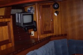In the Saloon showing tv, fine wood work  and seating